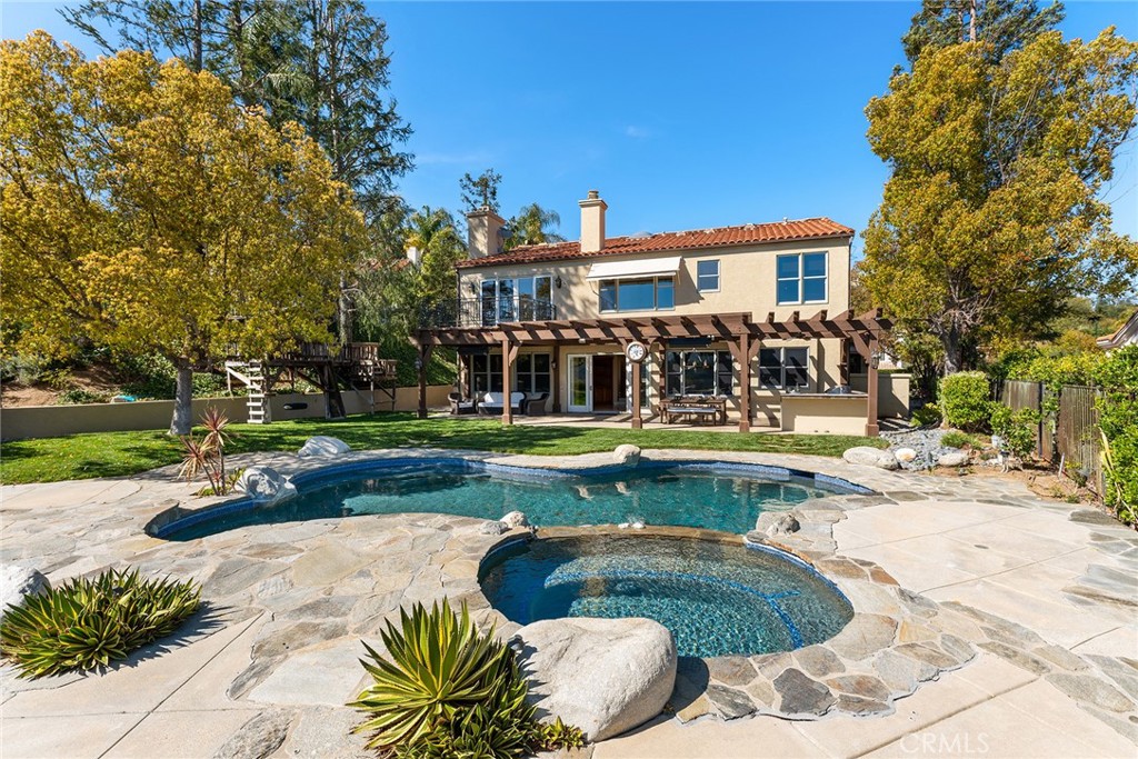 24920 Paseo Del Rancho Calabasas, CA 91302 - Photo 50 of 61 a view of a house with swimming pool and sitting area
