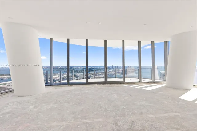 a view of an empty room with a large window