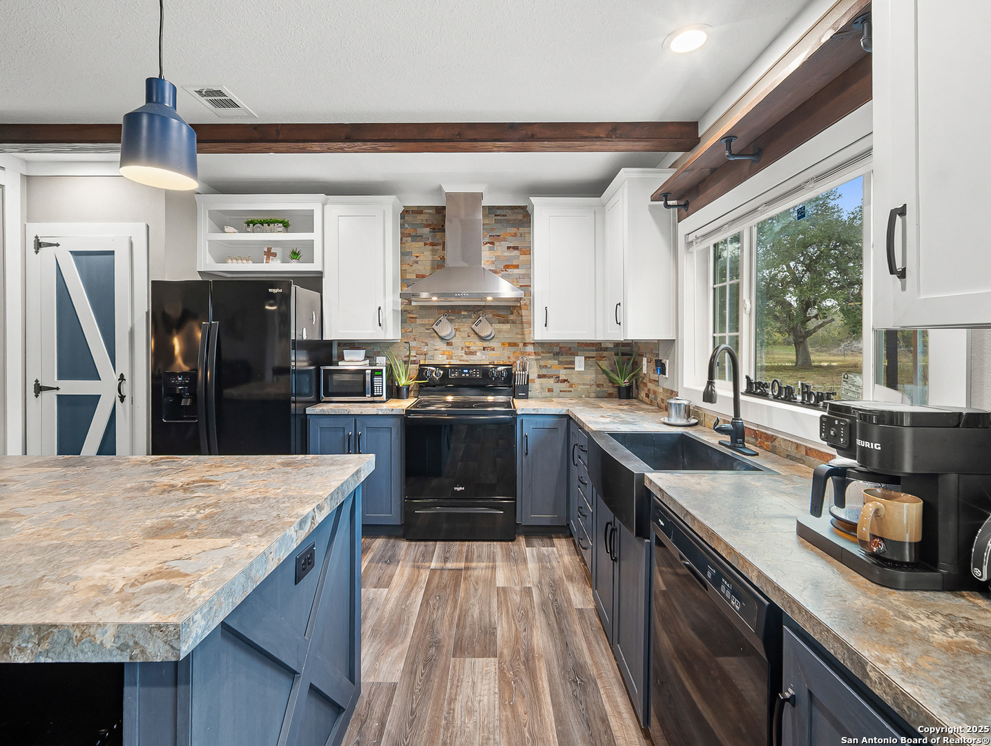 3809 Callihan Road Luling, TX 78648 - Photo 13 of 38 a kitchen with stainless steel appliances granite countertop sink stove top oven and refrigerator