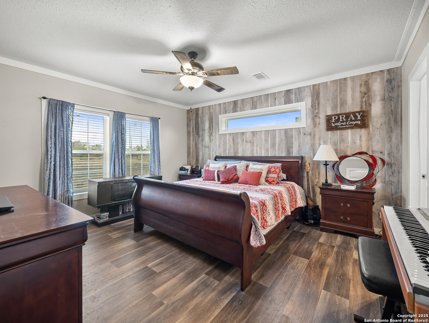 3809 Callihan Road Luling, TX 78648 - Photo 15 of 38 a bedroom with a bed and wooden floor