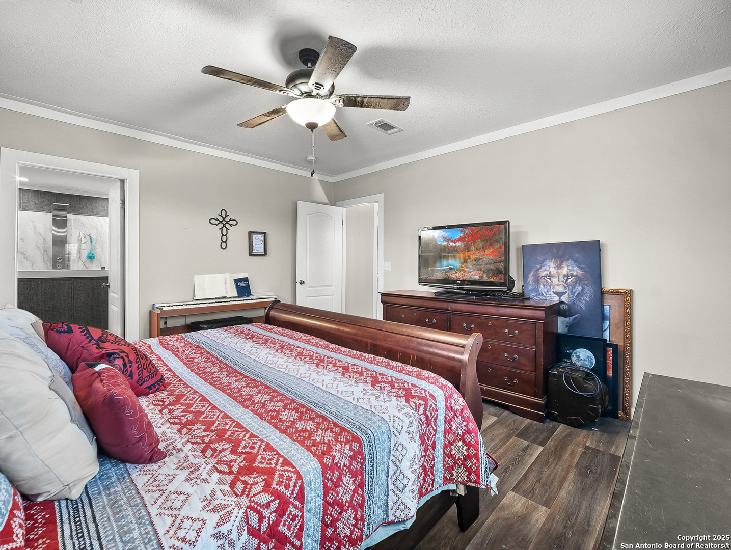 3809 Callihan Road Luling, TX 78648 - Photo 16 of 38 a bedroom with a bed and a flat screen tv