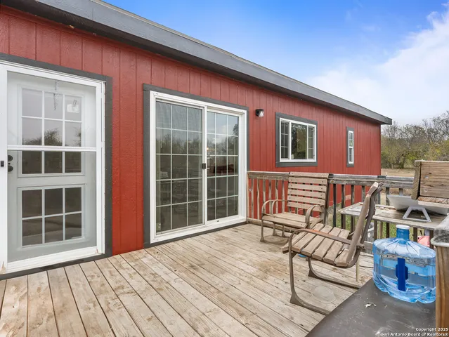 a balcony with furniture and windows