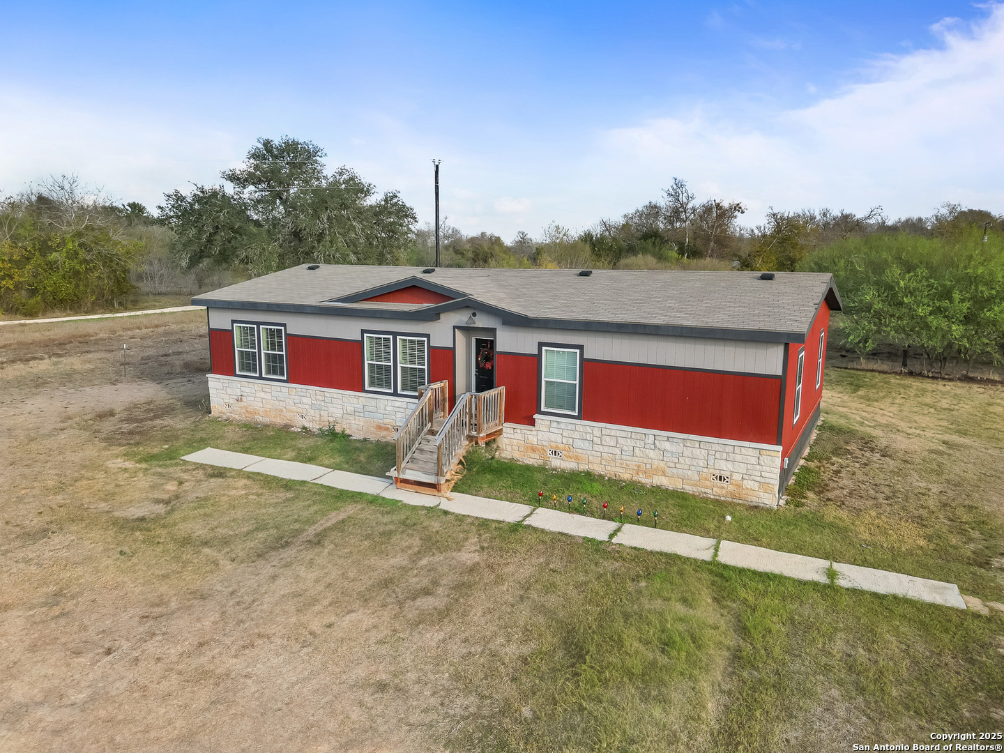 3809 Callihan Road Luling, TX 78648 - Photo 3 of 38 a front view of a house with a yard