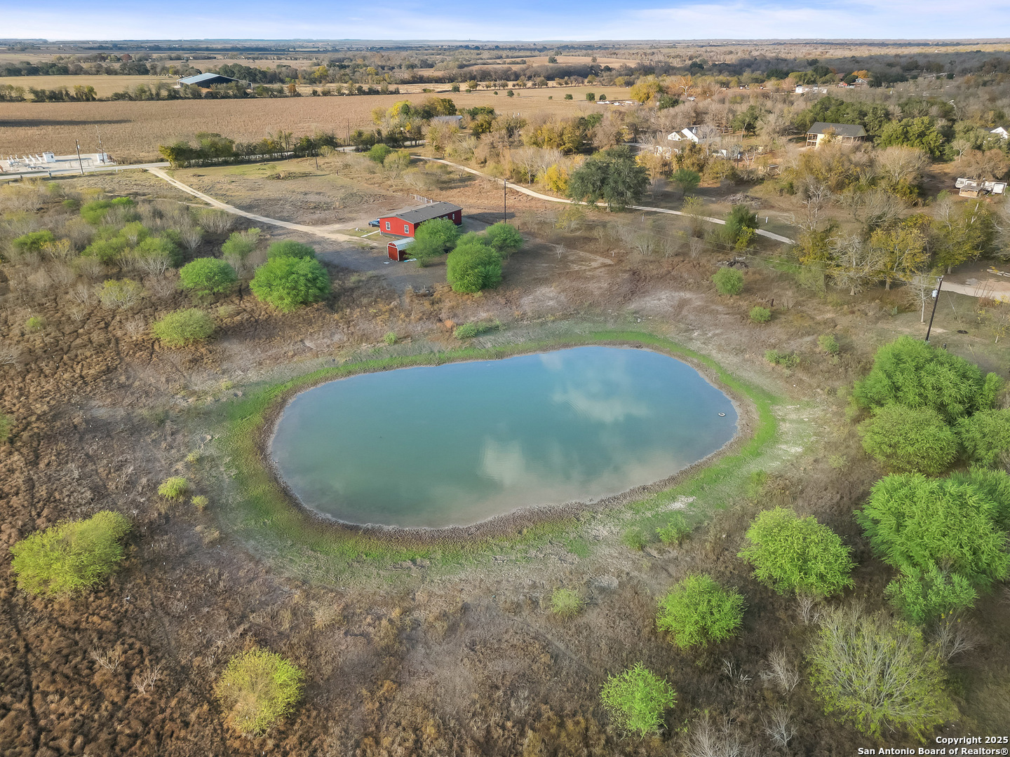 3809 Callihan Road Luling, TX 78648 - Photo 36 of 38 an aerial view of a house with a yard and lake view
