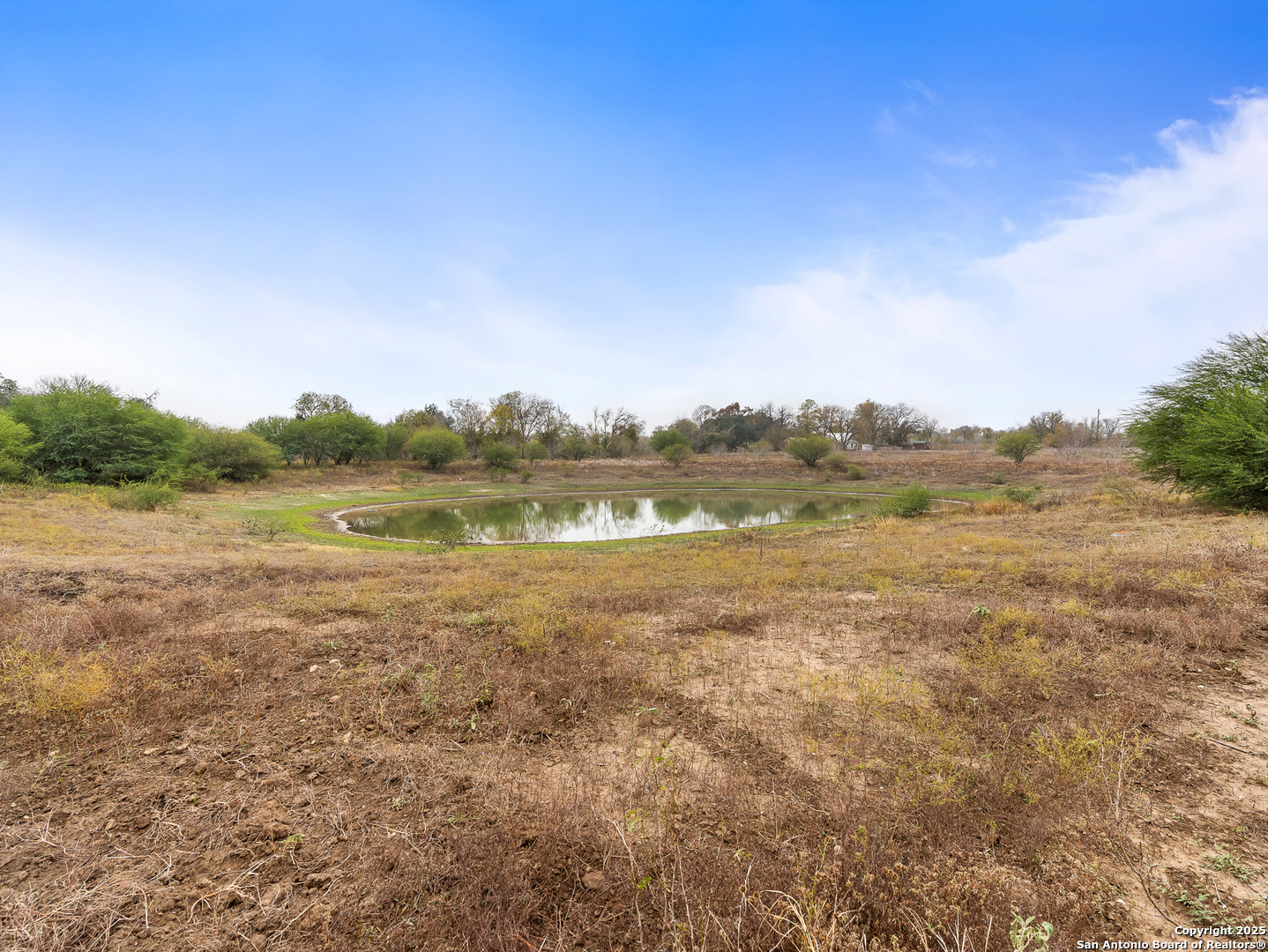 3809 Callihan Road Luling, TX 78648 - Photo 37 of 38 a view of a lake with houses in the background