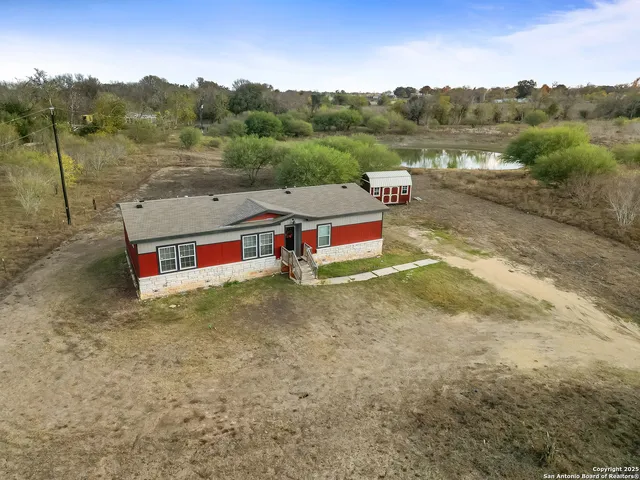 a view of a big yard with table and chairs