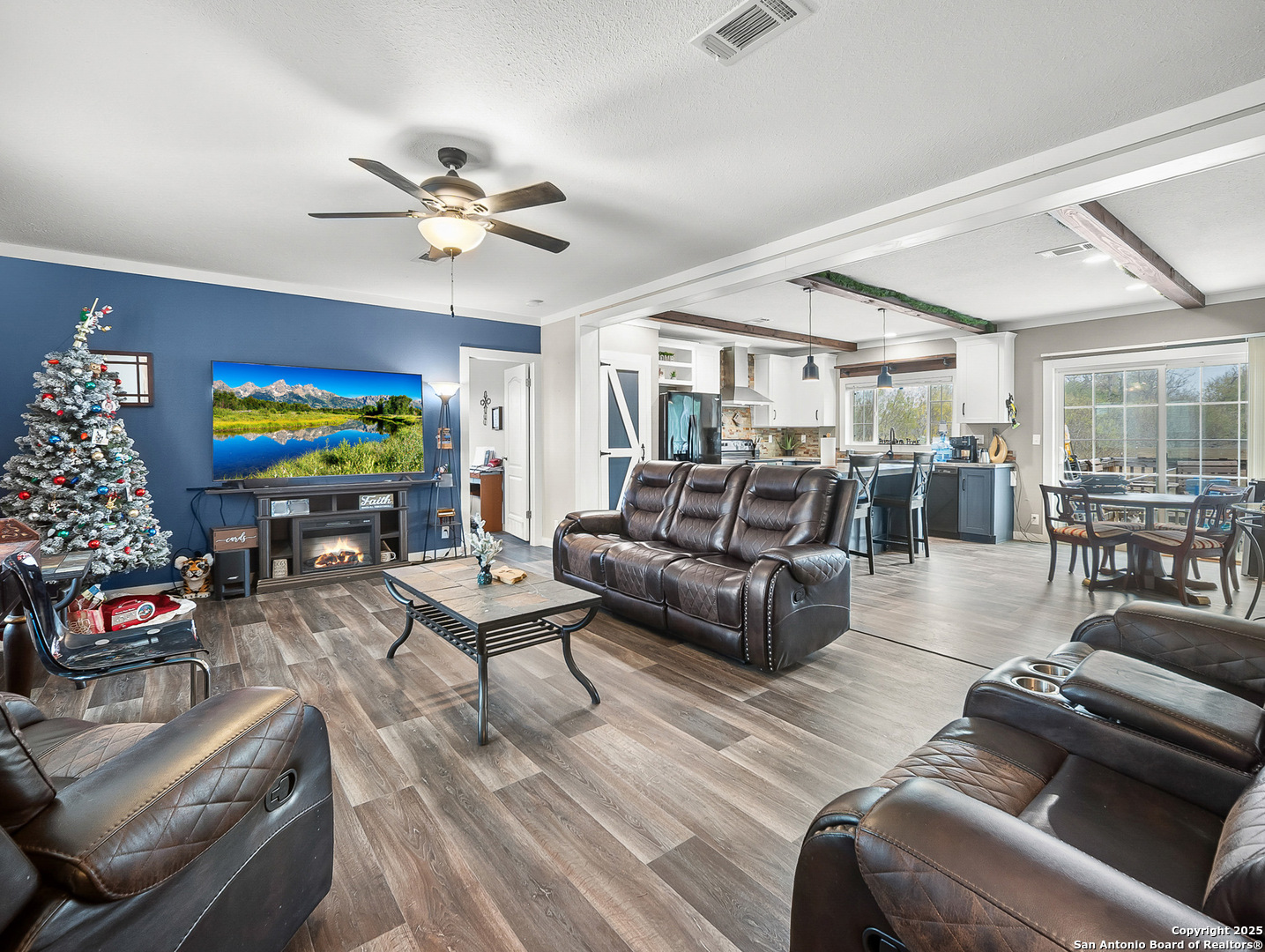 3809 Callihan Road Luling, TX 78648 - Photo 7 of 38 a living room with furniture and a flat screen tv with wooden floor