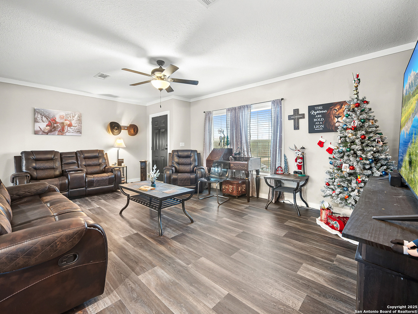 3809 Callihan Road Luling, TX 78648 - Photo 8 of 38 a living room with furniture a chandelier and a window