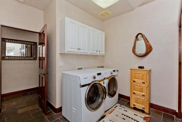 a utility room with dryer and washer