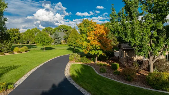 a view of a golf course with a house