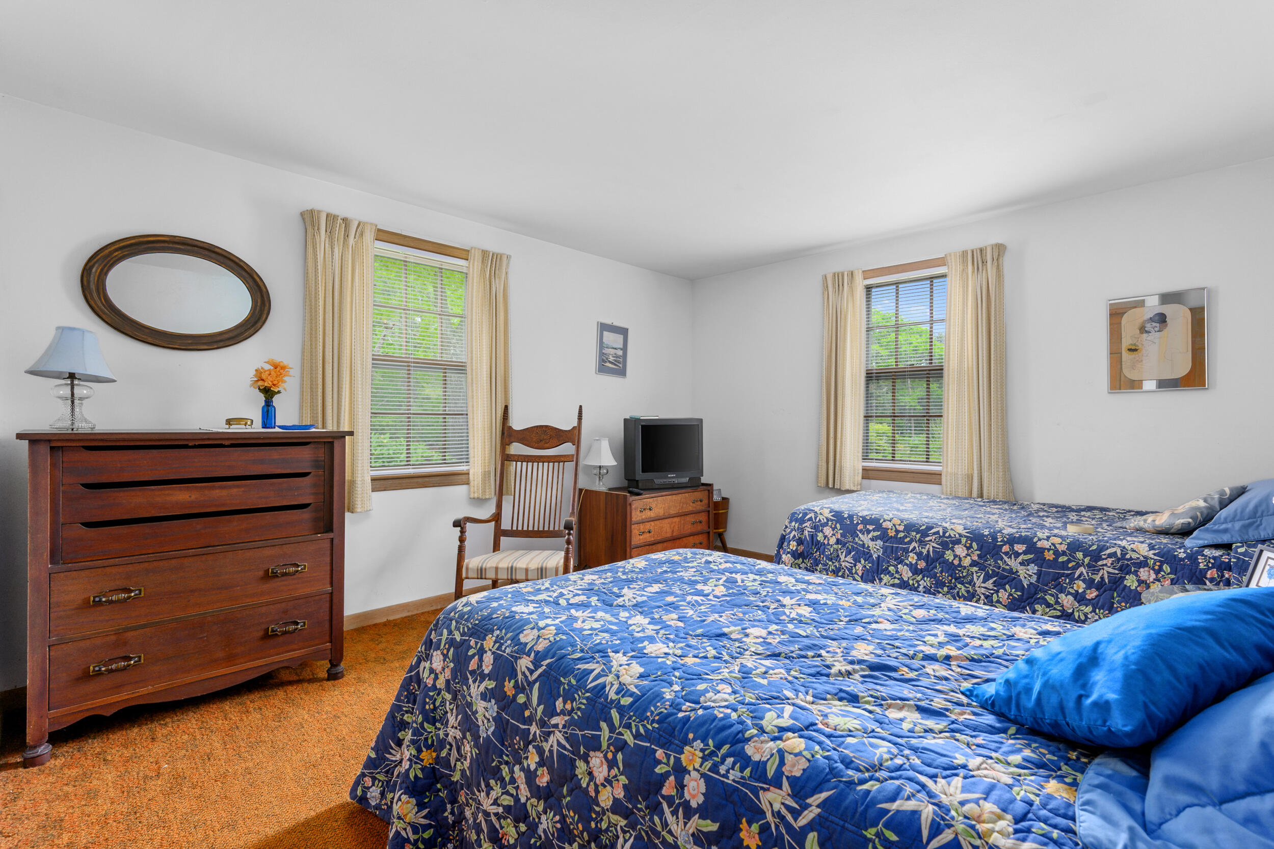 59 Beverly Road West Yarmouth, MA 02673 - Photo 25 of 33 a bedroom with a bed and a dresser