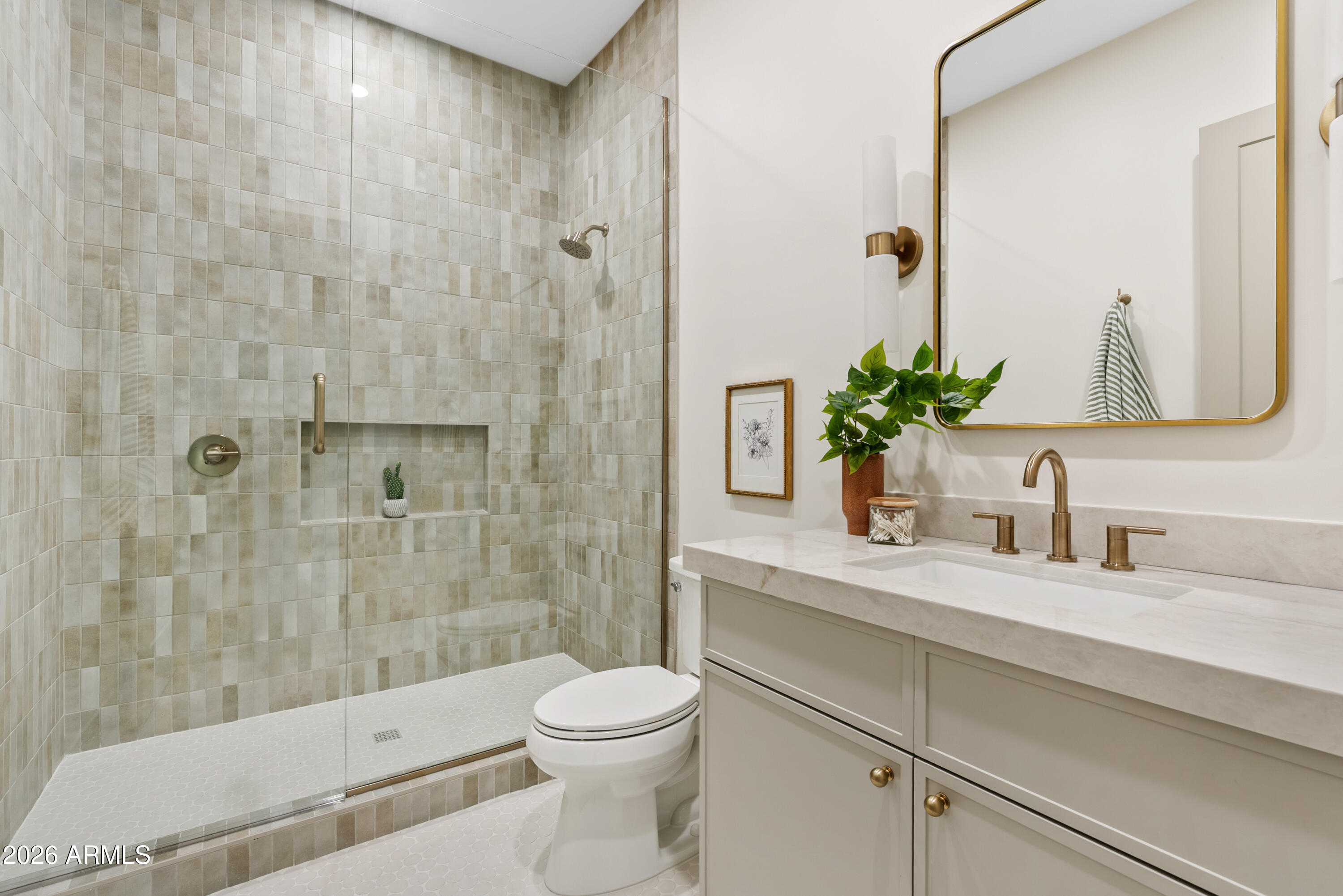 4035 East Osborn Road Phoenix, AZ 85018 - Photo 36 of 63 a bathroom with a granite countertop sink a toilet and a mirror