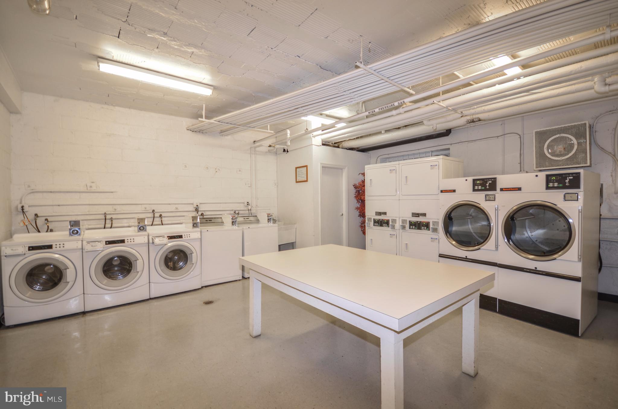 4100 W Street Northwest, Unit 303 Washington, DC 20007 - Photo 13 of 15 a utility room with dryer and washer