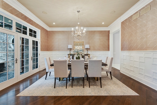 Undisclosed Address Glencoe, IL 60022 - Photo 11 of 30 a dining room with furniture a chandelier and wooden floor