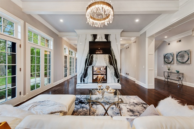 Undisclosed Address Glencoe, IL 60022 - Photo 12 of 30 a living room with furniture and a clock