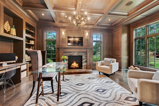 Undisclosed Address Glencoe, IL 60022 - Photo 14 of 30 a living room with furniture a fireplace and a flat screen tv