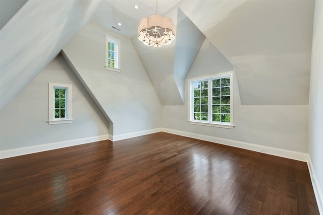 Undisclosed Address Glencoe, IL 60022 - Photo 20 of 30 a view of an empty room with wooden floor and a window