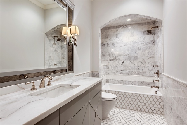 Undisclosed Address Glencoe, IL 60022 - Photo 21 of 30 a bathroom with a sink a toilet and shower