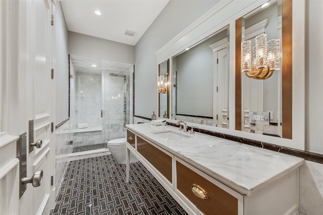 Undisclosed Address Glencoe, IL 60022 - Photo 22 of 30 a bathroom with a double vanity sink and a mirror