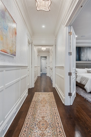 Undisclosed Address Glencoe, IL 60022 - Photo 23 of 30 a view of a hallway with wooden floor and staircase