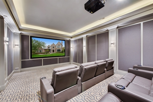 Undisclosed Address Glencoe, IL 60022 - Photo 24 of 30 a living room with furniture and a flat screen tv