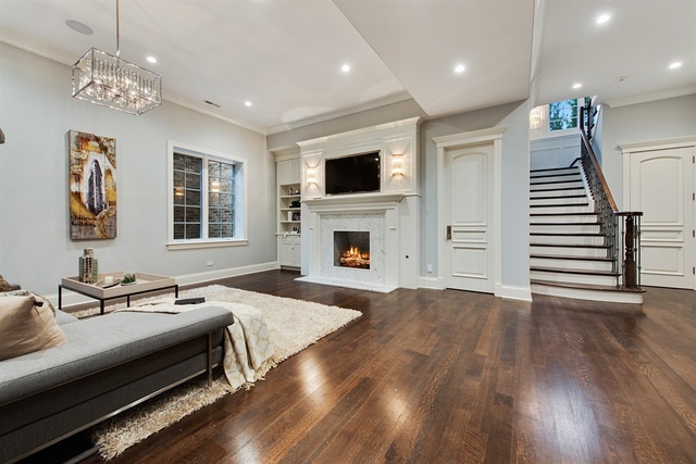 Undisclosed Address Glencoe, IL 60022 - Photo 25 of 30 a spacious bedroom with a bed and a fireplace