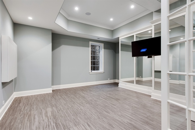 Undisclosed Address Glencoe, IL 60022 - Photo 29 of 30 an empty room with wooden floor and windows