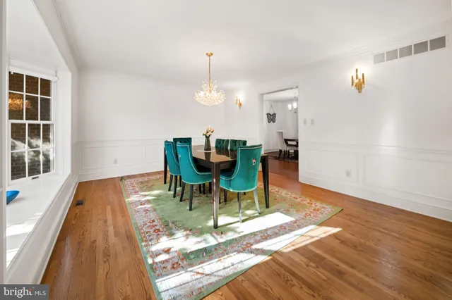 a kitchen with stainless steel appliances granite countertop a stove a sink dishwasher and cabinets with wooden floor