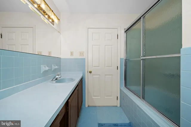 a backyard of a house with lots of green space and lake view