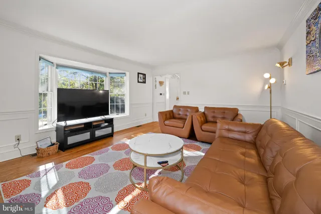 a kitchen with wooden floors and wooden cabinets