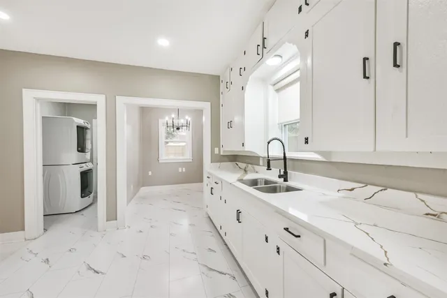 a bathroom with double sink and a mirror