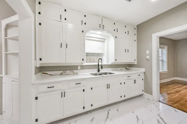 a view of a hallway with wooden walls