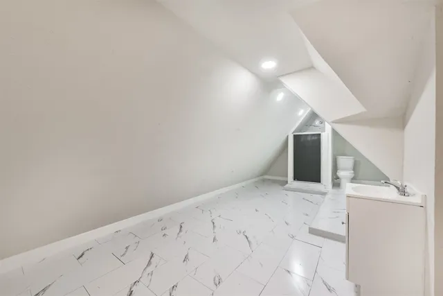 a bathroom with a sink a toilet and a bathtub