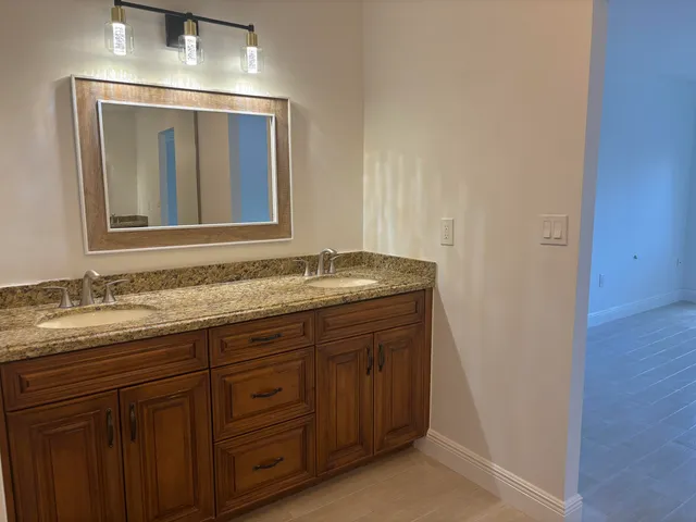 a lobby with furniture and flat screen tv