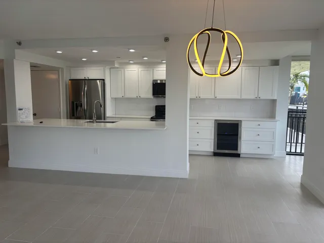 a view of a balcony with floor to ceiling windows with yard