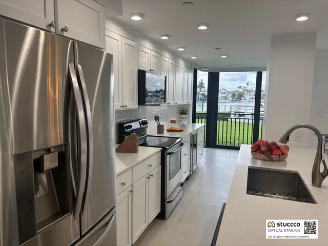 an empty room with windows and view of lake