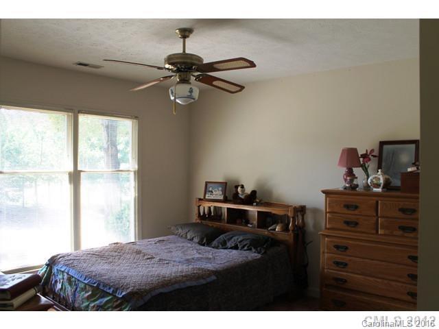 5214 Davis Road Waxhaw, NC 28173 - Photo 14 of 24 a bedroom with a bed and a window
