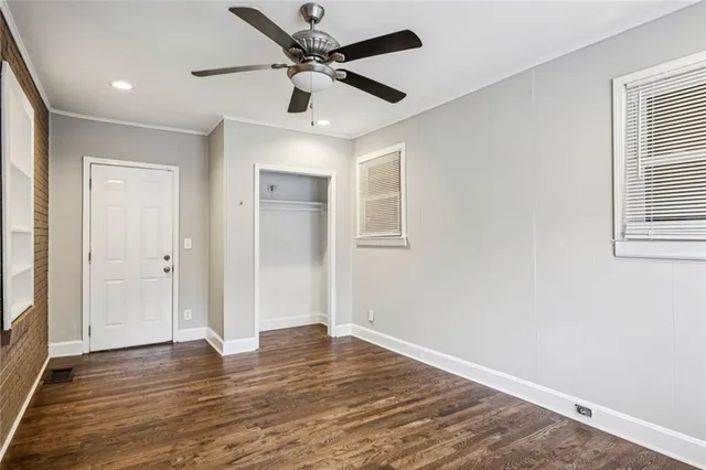 a view of a field with a tree