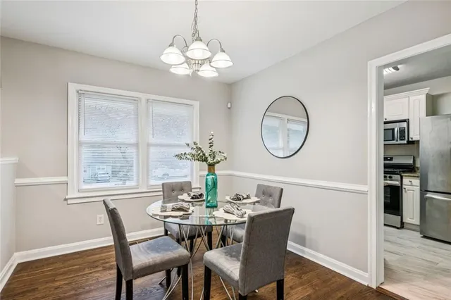 a view of a dining room with furniture window and outside view