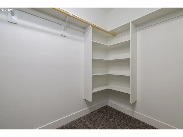 a view of an empty walk in closet