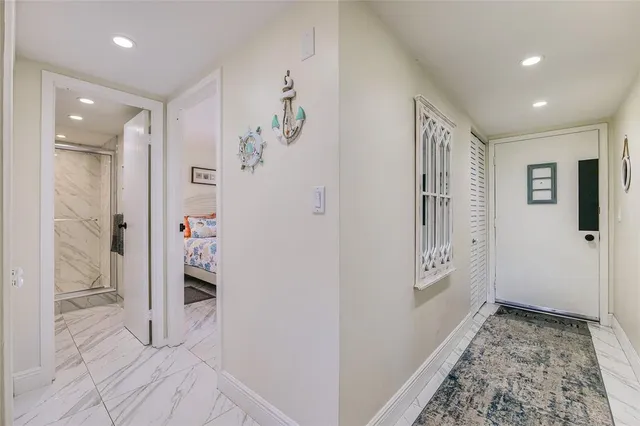 a bathroom with a shower and a sink