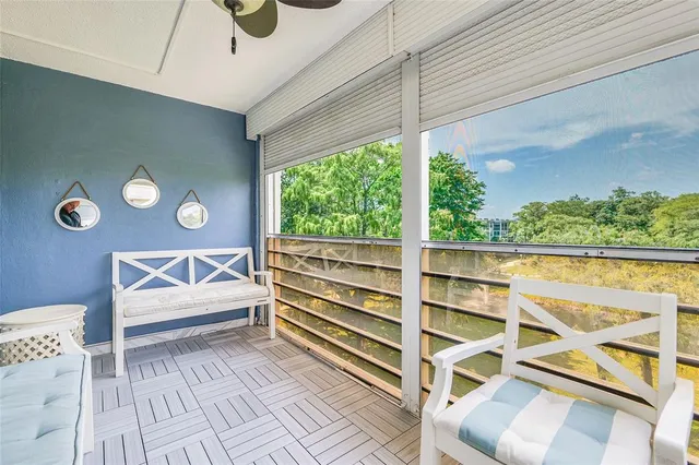 a view of a chairs and table in a patio