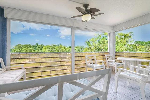 a view of a lot of large windows and a big yard