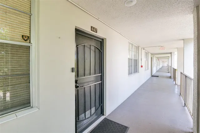 a view of a hallway with a white walls