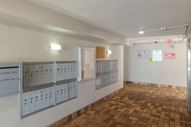 a view of a park with trees and a lake