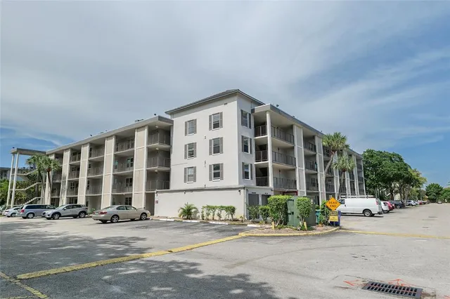 a view of a park with large trees