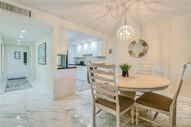 a view of a dining room and chandelier