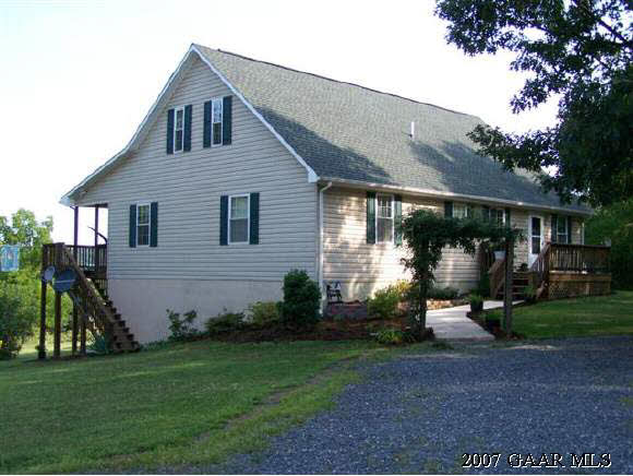 589 Curry Road Churchville, VA 24421 - Photo 1 of 12 a front view of a house with garden
