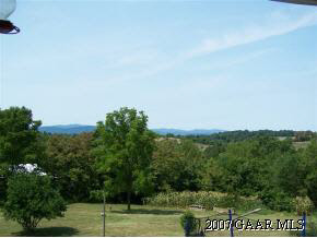 589 Curry Road Churchville, VA 24421 - Photo 11 of 12 a view of a field of grass and trees