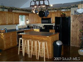 589 Curry Road Churchville, VA 24421 - Photo 4 of 12 a kitchen with stainless steel appliances granite countertop a stove a refrigerator a sink a dining table and chairs